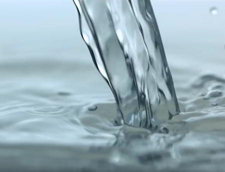 Close-up slow motion capture of water pouring