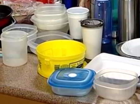 A variety of plastic containers displayed on a kitchen counter